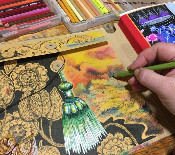 Coloring the envelope pocket of Dylusions Creative Journal Square.