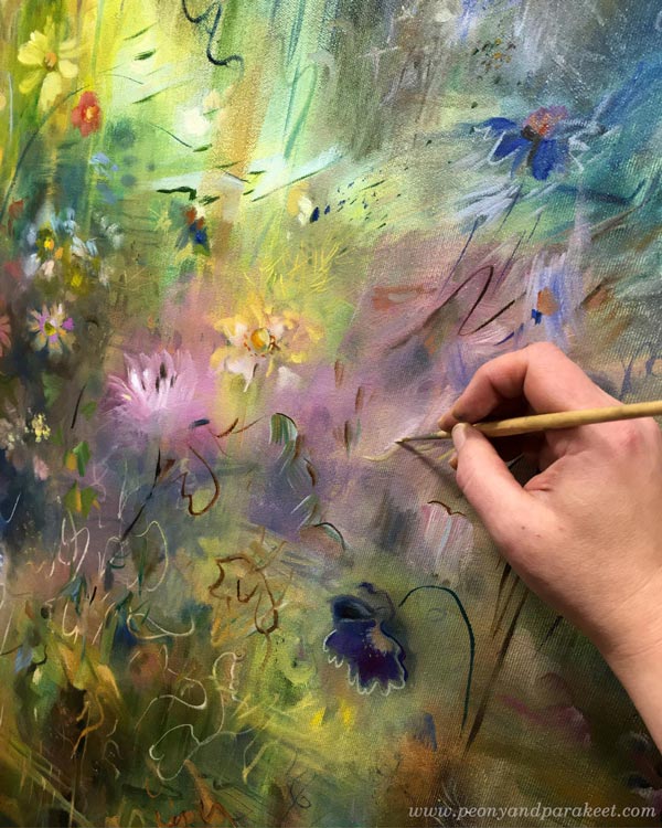 Painting abstract flowers in oil.