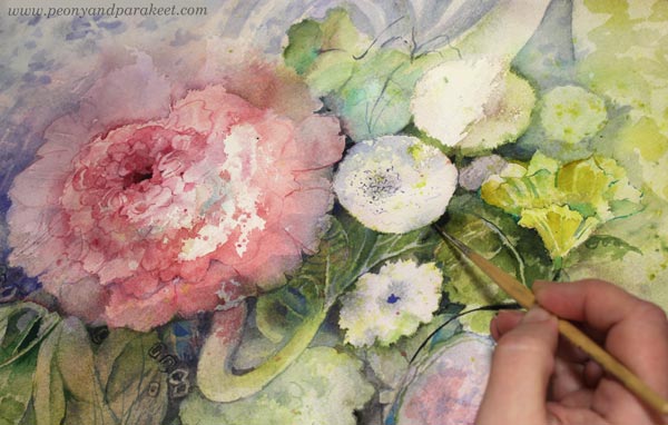 Painting details with a thin brush.