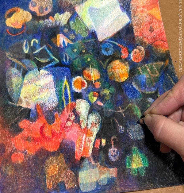 Finishing a colored pencil drawing.