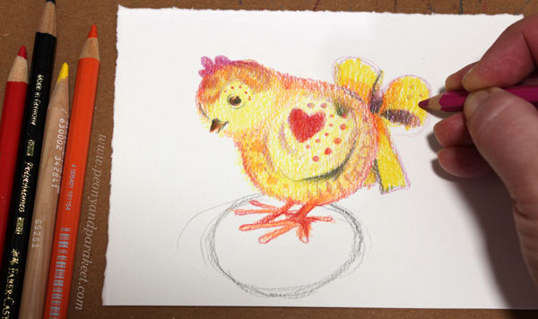 Adding decorations to an Easter chick.