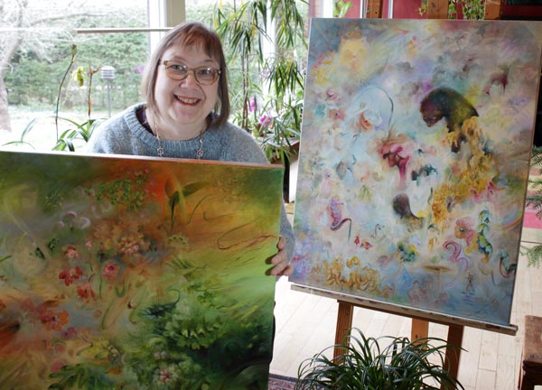 Päivi Eerola and her paintings.