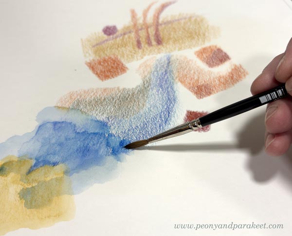 Coloring abstract shapes with watercolor pencils.