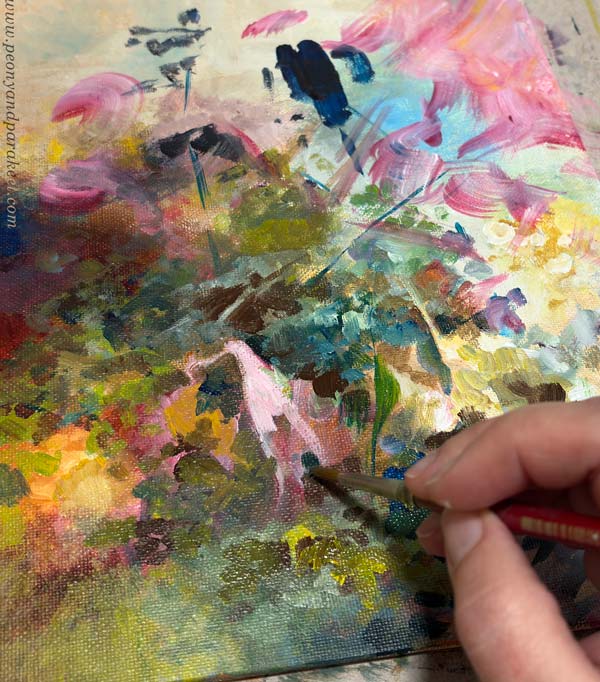 Adjusting details of a small acrylic painting.