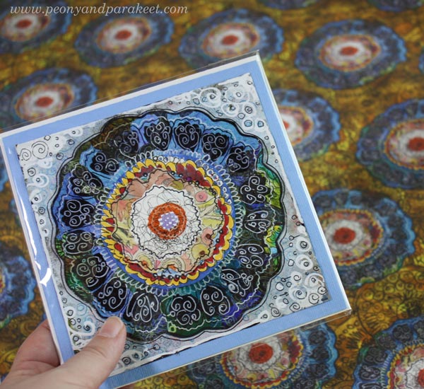 A flower card from hand-decorated papers and a fabric designed from it.